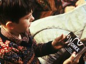 Charlie gets ready to unwrap his birthday present.