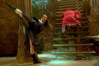 River (Summer Glau) attacking people in the bar.