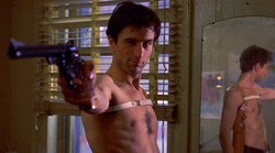 "You talkin' to me?" Alone in his apartment, Travis postures and practices his moves in front of the mirror
